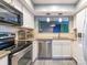 Modern kitchen featuring stainless appliances, granite countertops, and ample cabinet space at 9427 S Vicksburg Park Ct, Charlotte, NC 28210