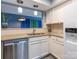 Kitchen showcasing granite countertops, stainless steel dishwasher, and white cabinetry at 9427 S Vicksburg Park Ct, Charlotte, NC 28210