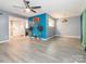 Bright, open living room with ceiling fan and modern flooring at 9427 S Vicksburg Park Ct, Charlotte, NC 28210