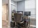 Practical home office setup with neutral tones, a compact desk, and essential equipment for remote work at 9427 S Vicksburg Park Ct, Charlotte, NC 28210