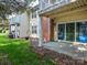 Backyard view of a home's patio with brick trim, an external AC unit, and sliding glass doors at 9427 S Vicksburg Park Ct, Charlotte, NC 28210