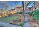 An exterior view shows a brick apartment building, walkway, and courtyard at 101 S Laurel Ave # 72A, Charlotte, NC 28207