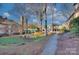 Condo complex with trees, green space, courtyard sitting area and convenient parking at 101 S Laurel Ave # 72A, Charlotte, NC 28207