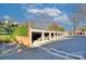 Row of garages are adjacent to the brick apartment building at 101 S Laurel Ave # 72A, Charlotte, NC 28207