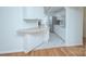 The kitchen has sleek countertops, ample white cabinetry, and stainless-steel appliances at 101 S Laurel Ave # 72A, Charlotte, NC 28207