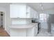 Bright, modern condo kitchen with white cabinets, sleek countertops, and stainless steel appliances at 101 S Laurel Ave # 72A, Charlotte, NC 28207