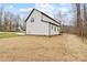 Spacious backyard featuring white siding and ample room for outdoor activities at 10405 Briarhurst Pl # 18, Mint Hill, NC 28227