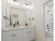 Bright bathroom features a double sink vanity with modern fixtures and a walk-in shower-tub combination at 10405 Briarhurst Pl # 18, Mint Hill, NC 28227