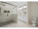 Modern bathroom featuring a walk-in shower with black and white tile and double vanity sinks at 10405 Briarhurst Pl # 18, Mint Hill, NC 28227