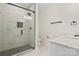 Bathroom featuring glass enclosed shower with marble tile surround and modern fixtures at 10405 Briarhurst Pl # 18, Mint Hill, NC 28227
