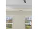 Bedroom with two windows with views and a ceiling fan at 10405 Briarhurst Pl # 18, Mint Hill, NC 28227