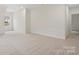 Spacious bonus room with plush carpeting offers versatility for various living arrangements and a cozy atmosphere at 10405 Briarhurst Pl # 18, Mint Hill, NC 28227