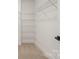 Walk-in closet with white wire shelving and neutral carpet at 10405 Briarhurst Pl # 18, Mint Hill, NC 28227