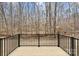 Wood deck overlooking a wooded area and small creek at 10405 Briarhurst Pl # 18, Mint Hill, NC 28227