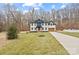 Charming two-story home featuring a well-manicured lawn and a two-car garage at 10405 Briarhurst Pl # 18, Mint Hill, NC 28227