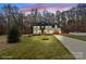 Charming two-story home with manicured lawn and inviting curb appeal at 10405 Briarhurst Pl # 18, Mint Hill, NC 28227