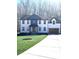 Beautiful two-story home boasts a manicured lawn and a driveway leading to an attached two-car garage at 10405 Briarhurst Pl # 18, Mint Hill, NC 28227