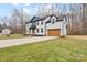 Attractive two-story home with a well-kept lawn and an attached garage at 10405 Briarhurst Pl # 18, Mint Hill, NC 28227