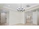 Hallway view showcasing modern lighting fixtures and an open view into the kitchen at 10405 Briarhurst Pl # 18, Mint Hill, NC 28227