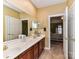 Bathroom with double vanity and adjoining shower and bedroom, providing privacy at 11406 Olde Turnbury Ct, Charlotte, NC 28277