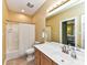 Bright bathroom features a shower/tub combo, a toilet, and a vanity with a sink at 11406 Olde Turnbury Ct, Charlotte, NC 28277