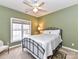 Bedroom featuring neutral carpeting, bright window, and a decorative rug at 11406 Olde Turnbury Ct, Charlotte, NC 28277