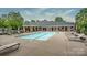 Inviting community pool area with lounge chairs for relaxation and a sparkling swimming pool at 11406 Olde Turnbury Ct, Charlotte, NC 28277