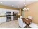 Bright eat-in kitchen featuring stainless steel appliances and white cabinetry at 11406 Olde Turnbury Ct, Charlotte, NC 28277
