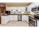 Well-equipped kitchen featuring modern stainless steel appliances and granite countertops at 11406 Olde Turnbury Ct, Charlotte, NC 28277