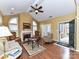 Bright living room with fireplace and french doors leading to the outdoors, great for relaxing at 11406 Olde Turnbury Ct, Charlotte, NC 28277