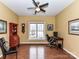 Home office featuring hardwood floors, natural light, and classic decor at 11406 Olde Turnbury Ct, Charlotte, NC 28277
