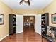 Open-concept home office with hardwood floors and convenient access to living areas at 11406 Olde Turnbury Ct, Charlotte, NC 28277
