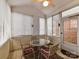 Enclosed porch perfect for relaxing, furnished with a table, chairs, and many windows at 11406 Olde Turnbury Ct, Charlotte, NC 28277