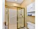 Shower room featuring a glass door, built-in bench, and shower accessories at 11406 Olde Turnbury Ct, Charlotte, NC 28277