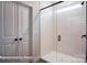 Bright bathroom featuring subway tile shower with glass door and modern fixtures at 121 N Prestwick Way # 43, Mooresville, NC 28115