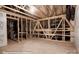 View of a framed unfinished room with exposed beams and ductwork ready to be customized to your liking at 121 N Prestwick Way # 43, Mooresville, NC 28115