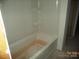 Bathroom features a white tub and shower combo at 122 Peppervine Ln, Statesville, NC 28625