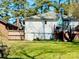 Spacious backyard offers a deck, lush lawn, and charming ambiance for outdoor enjoyment at 127 E 11Th St, Salisbury, NC 28144