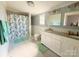 Bright bathroom with a double sink vanity and decorative shower curtain at 127 E 11Th St, Salisbury, NC 28144