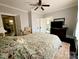 Cozy bedroom with a patterned bedspread and neutral decor at 127 E 11Th St, Salisbury, NC 28144