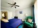 Relaxing bedroom boasts a ceiling fan, large window with sheer curtains, and comfortable seating at 127 E 11Th St, Salisbury, NC 28144