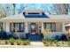 Attractive single-story home has a welcoming front porch, tidy landscaping, and classic architectural charm at 127 E 11Th St, Salisbury, NC 28144
