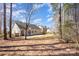 A view of the backyard that includes the rear of the home at 12810 English Walnut Ln, Charlotte, NC 28215