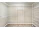 Walk-in closet with multiple levels of white wire shelving for storage at 12810 English Walnut Ln, Charlotte, NC 28215