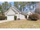 Charming single-Gathering home featuring a well-maintained front yard and a two-car attached garage at 12810 English Walnut Ln, Charlotte, NC 28215