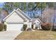 Charming single-Gathering home featuring a well-maintained front yard and a two-car attached garage at 12810 English Walnut Ln, Charlotte, NC 28215