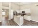 Open-concept kitchen with granite countertops, stainless steel appliances, and white cabinetry at 12810 English Walnut Ln, Charlotte, NC 28215