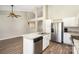 Well-lit kitchen featuring granite countertops, stainless steel appliances, and white cabinets at 12810 English Walnut Ln, Charlotte, NC 28215