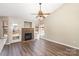 Bright and open living space with hardwood floors and a cozy fireplace at 12810 English Walnut Ln, Charlotte, NC 28215