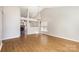Spacious living area features vaulted ceilings and seamless flow into the kitchen and fireplace at 12810 English Walnut Ln, Charlotte, NC 28215